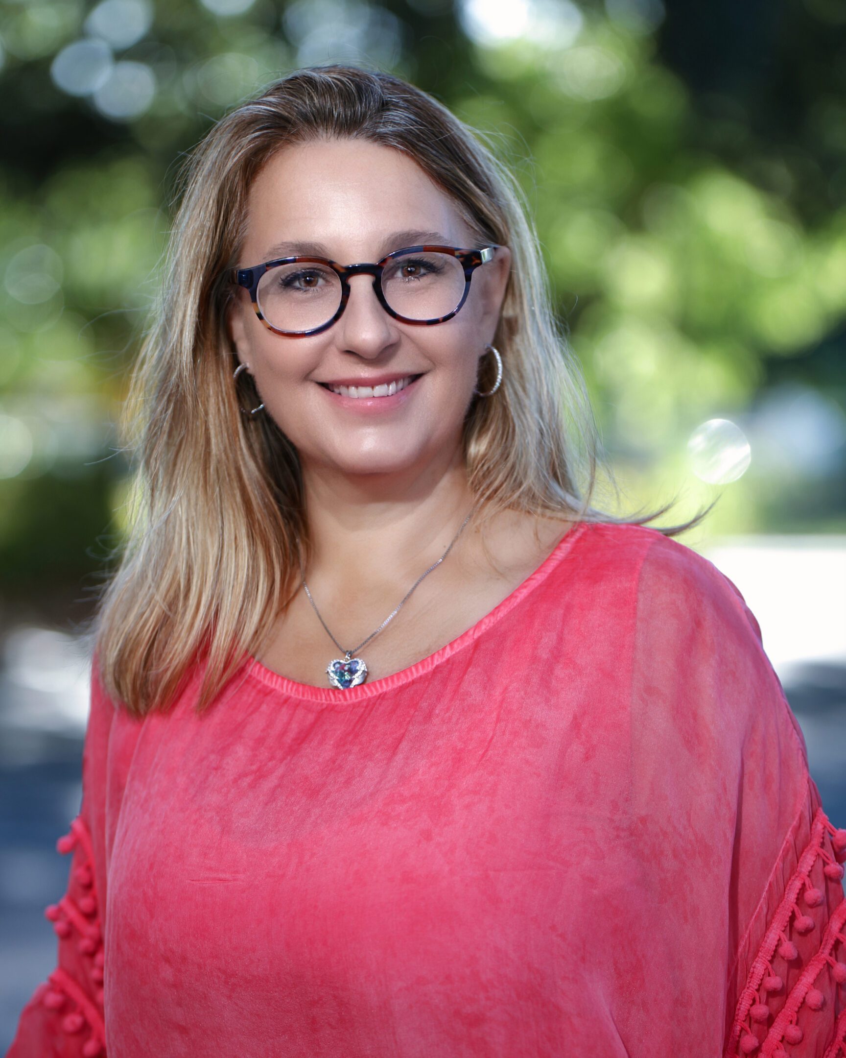 Federica Priano,Ph.D A woman in glasses and a pink shirt
